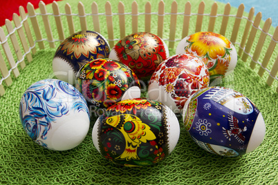 Multi-colored Easter eggs on a green background