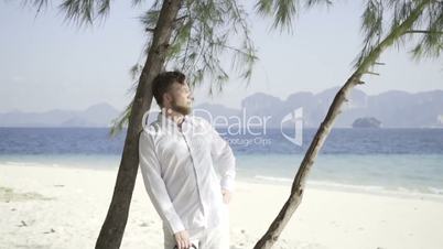 Man on the beautiful beach with a white sand.