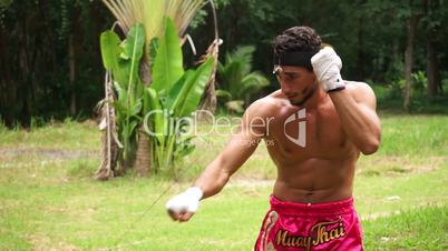 MuayThai boxer is boxing.