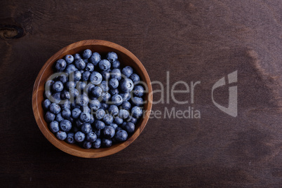 black currant in  wooden bowl