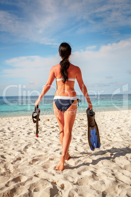Girl and snorkeling gear
