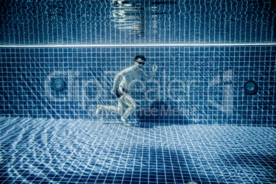 Man runs underwater swimming pool