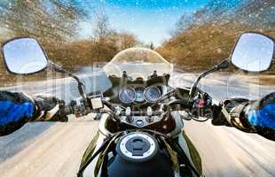 Biker First-person view. Winter slippery road