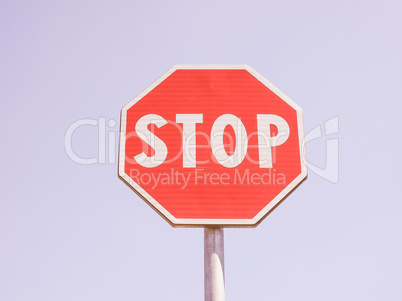 Stop sign over blue sky vintage