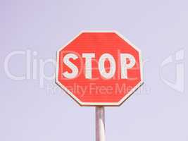 Stop sign over blue sky vintage