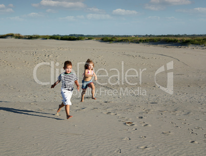 boy and little girl running