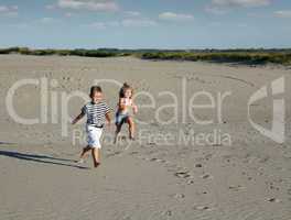 boy and little girl running
