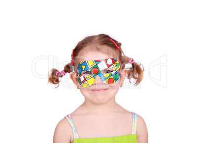 happy little girl with colorful party mask