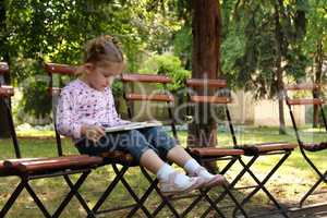 little girl reading a book