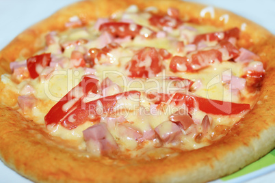 appetizing pizza with sausage and tomatoes