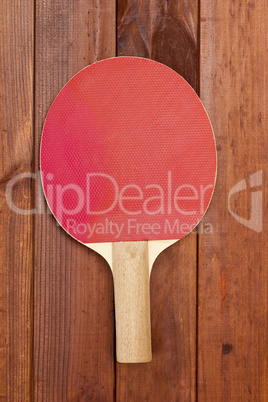 Tennis racket on a wooden table
