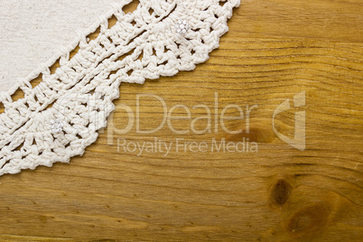 White decorative lace on the wooden table
