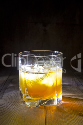 Glass of whiskey with ice