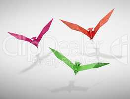 Group of three flying birds in Origami