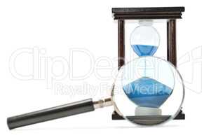 hourglass and magnifying glass