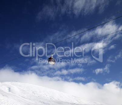 Gondola lift and blue sky with clouds in nice day