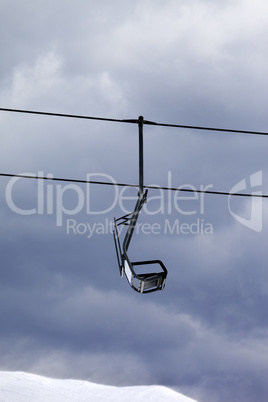 Chair lift at gray windy day