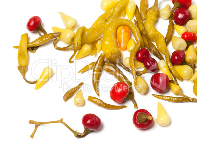 Mix of hot pickled peppers on white background
