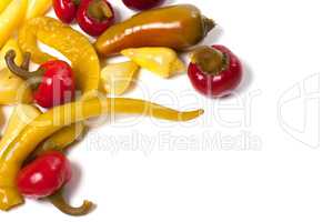 Mix of hot pickled peppers isolated on white background