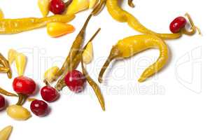 Mix of hot marinated peppers isolated on white background