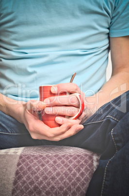 Young man with coffee pot