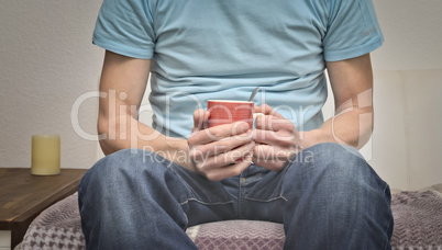 Young man with a pot of coffee