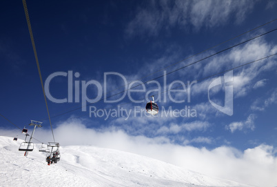 Gondola and chair-lifts at ski resort in nice day