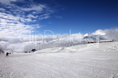 Ski slope at sun wind day