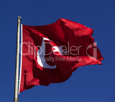 Sunlight Turkish flag waving in wind at sunny day