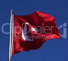 Sunlight Turkish flag waving in wind at sunny day