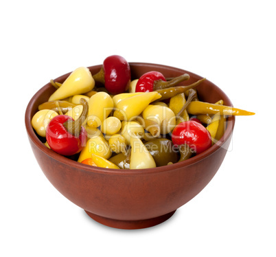 Mix of hot turkish marinated peppers in ceramic bowl