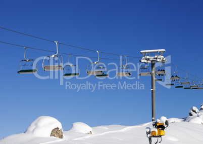 Chair-lift at ski resort at sun day after snowfall