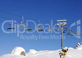 Chair-lift at ski resort at sun day after snowfall