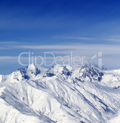 Sunny slopes of winter mountains