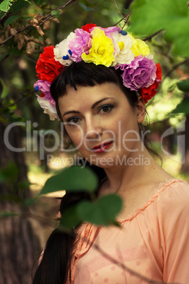 woman in wreath of roses on her head