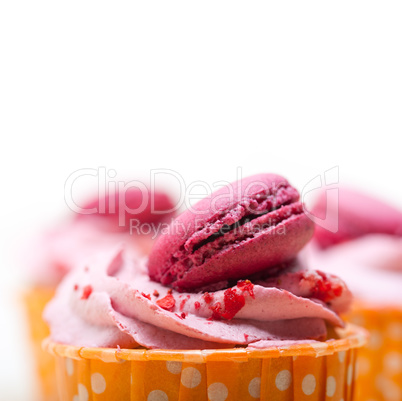 pink berry cream cupcake with macaroon on top