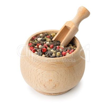 grains pepper and wooden scoop in pot