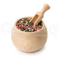 grains pepper and wooden scoop in pot
