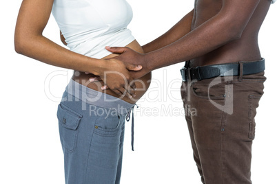 Man touching pregnant womans stomach