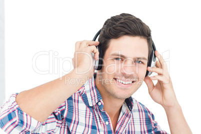 Man with headphones sitting on the floor