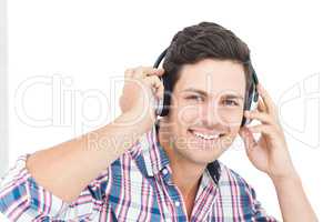 Man with headphones sitting on the floor