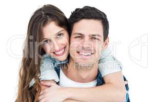 Cute couple embracing and looking the camera
