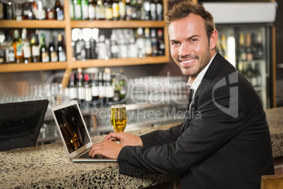 Handsome man using laptop computer