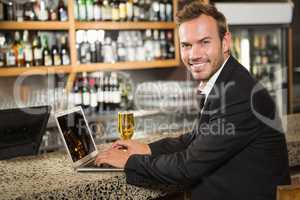 Handsome man using laptop computer