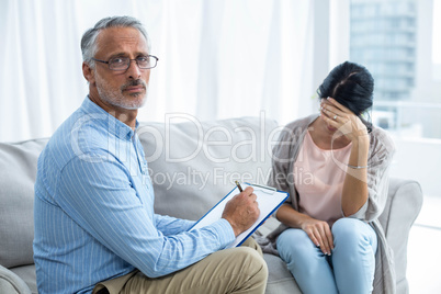 Therapist consoling a woman