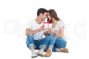 Happy couple receiving a gift