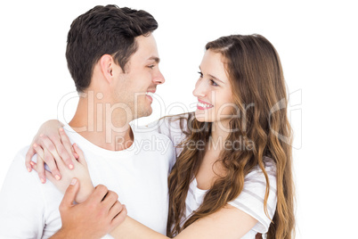 Cute couple embracing and looking to each other