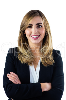 Smiling woman with arms crossed looking at the camera