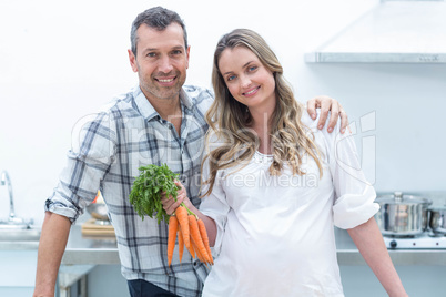 Pregnant couple in kitchen