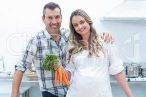 Pregnant couple in kitchen